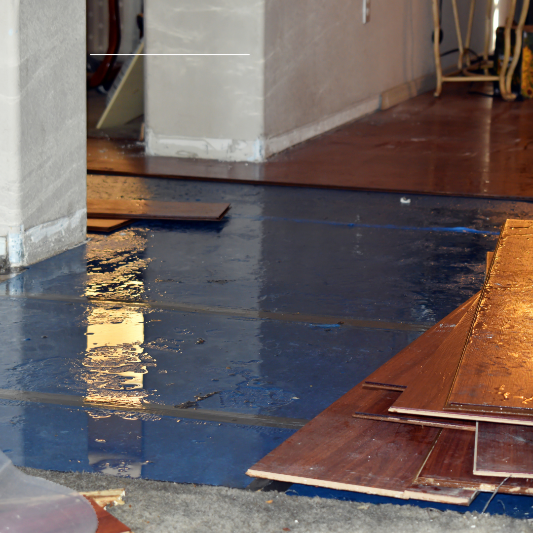 Water damage inside a home caused by a slab leak beneath the concrete foundation